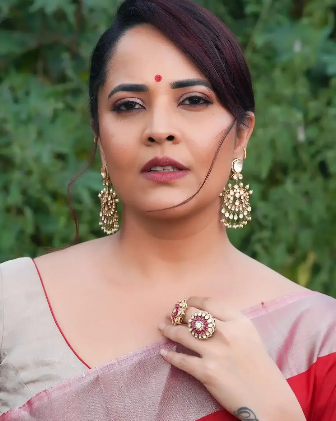 Anasuya Bharadwaj Jewellery Bangles Earrings Red Saree